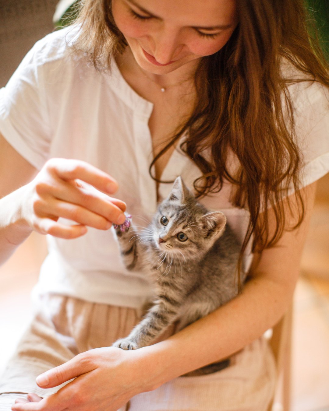 Young woman with kitten